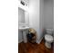 Simple bathroom with pedestal sink and hardwood floors at 613 Ravens Wood Rd, Summerville, SC 29486