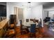 Bright dining room with hardwood floors and a glass-top table at 613 Ravens Wood Rd, Summerville, SC 29486