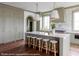 Modern kitchen with green cabinets and large island at 3215 Pine Needle Ln, Seabrook Island, SC 29455