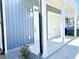 Exterior view of the front entrance and garage with blue siding and white trim at 2212 Clinton St, North Charleston, SC 29405