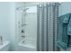 Clean bathroom with shower/tub combo, gray striped shower curtain, and blue towels at 145 Hedera Ct, Summerville, SC 29486