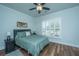 Bedroom with wood floors, plantation shutters, and ceiling fan at 145 Hedera Ct, Summerville, SC 29486