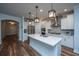 Modern kitchen with white cabinets, stainless steel appliances, and an island at 145 Hedera Ct, Summerville, SC 29486