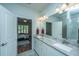Double vanity bathroom with granite countertop and access to bedroom at 145 Hedera Ct, Summerville, SC 29486