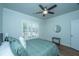 Bedroom with wood floors, plantation shutters, and ceiling fan at 145 Hedera Ct, Summerville, SC 29486