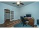 Home office with wood floors, french doors, and built-in shelving at 145 Hedera Ct, Summerville, SC 29486