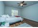Well-lit bedroom featuring wood floors and plantation shutters at 145 Hedera Ct, Summerville, SC 29486