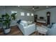 Living room with hardwood floors, comfortable seating, and a large window at 145 Hedera Ct, Summerville, SC 29486
