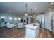 Open floor plan features a modern kitchen and spacious living area with hardwood floors at 145 Hedera Ct, Summerville, SC 29486