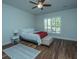 Bright bedroom with wood floors, plantation shutters, and ceiling fan at 145 Hedera Ct, Summerville, SC 29486
