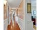 Bright hallway with hardwood floors and peach walls at 330 Concord St # 15E, Charleston, SC 29401