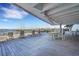 Relaxing waterfront deck with seating and tables, offering scenic water views at 330 Concord St # 15E, Charleston, SC 29401