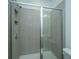 Modern shower with glass enclosure and gray tile at 801 Twin Rivers Dr, Wando, SC 29492