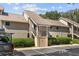Tan colored building exterior with parking at 121 High Hammock Villas # 121, Seabrook Island, SC 29455