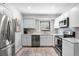 Modern kitchen with stainless steel appliances and white cabinets at 121 High Hammock Villas # 121, Seabrook Island, SC 29455