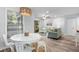 Bright dining area with a round table and four white chairs at 121 High Hammock Villas # 121, Seabrook Island, SC 29455