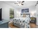 Beach-themed bedroom with a queen-size bed and barn door at 121 High Hammock Villas # 121, Seabrook Island, SC 29455