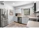 Updated kitchen featuring stainless steel appliances and white shaker cabinets at 121 High Hammock Villas # 121, Seabrook Island, SC 29455