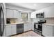Modern kitchen with stainless steel appliances and white cabinets at 121 High Hammock Villas # 121, Seabrook Island, SC 29455