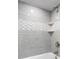 Shower with grey tile and wave pattern accent at 121 High Hammock Villas # 121, Seabrook Island, SC 29455