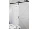 White barn door with black hardware at 121 High Hammock Villas # 121, Seabrook Island, SC 29455