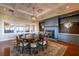 Elegant dining room with a large table, fireplace, and built-in cabinetry at 121 High Hammock Villas # 121, Seabrook Island, SC 29455
