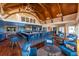 Elegant bar with blue seating and high ceilings in clubhouse at 121 High Hammock Villas # 121, Seabrook Island, SC 29455