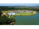 Aerial view of community clubhouse with pool and lake at 121 High Hammock Villas # 121, Seabrook Island, SC 29455
