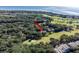 Property location shown in wider aerial view near golf course and ocean at 121 High Hammock Villas # 121, Seabrook Island, SC 29455