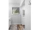 Clean bathroom with white vanity and wood-look flooring at 121 High Hammock Villas # 121, Seabrook Island, SC 29455