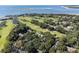 Aerial view of coastal community with golf course and waterfront access at 121 High Hammock Villas # 121, Seabrook Island, SC 29455