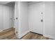 Modern entryway with white door and wood-look flooring at 121 High Hammock Villas # 121, Seabrook Island, SC 29455