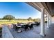 Relaxing outdoor patio overlooking a golf course with fire pits and seating at 121 High Hammock Villas # 121, Seabrook Island, SC 29455