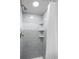 Shower with wave patterned tile and built-in shelves at 121 High Hammock Villas # 121, Seabrook Island, SC 29455