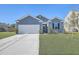 Gray house with white garage door and black shutters at 124 Pontoria Dr, Summerville, SC 29483