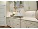 Modern kitchen with gas cooktop and white shaker cabinets at 107 Grange Cir, Summerville, SC 29486