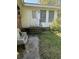 Small patio area with a bench and access to the backyard at 8520 Delhi Rd, North Charleston, SC 29406