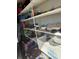 White shelves stocked with various items at 8520 Delhi Rd, North Charleston, SC 29406