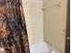 A bathtub and shower with tiled walls at 8520 Delhi Rd, North Charleston, SC 29406