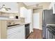 Modern kitchen with white cabinets, stainless steel appliances, and granite counters at 1615 Chatelain Way, Mount Pleasant, SC 29464