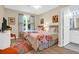 Bright bedroom with two twin beds, a dresser, and a view of the backyard at 1615 Chatelain Way, Mount Pleasant, SC 29464