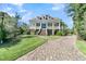 House exterior with brick driveway and manicured lawn at 1913 Mooring Line Way, Mount Pleasant, SC 29466
