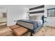 Stylish bedroom with striped wall and hardwood floors at 1913 Mooring Line Way, Mount Pleasant, SC 29466