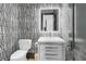 Modern powder room with stylish wallpaper and a floating vanity at 1913 Mooring Line Way, Mount Pleasant, SC 29466