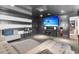 Basement home theater with large screen and comfortable seating at 1913 Mooring Line Way, Mount Pleasant, SC 29466