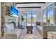 Cozy sitting area with stone fireplace, large windows, and comfortable seating at 1913 Mooring Line Way, Mount Pleasant, SC 29466