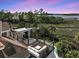Large rooftop deck with outdoor fireplace and partial water views at 1913 Mooring Line Way, Mount Pleasant, SC 29466