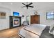 Main bedroom with fireplace, water views, and hardwood floors at 1913 Mooring Line Way, Mount Pleasant, SC 29466