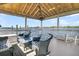 Covered dock seating area with water views at 1913 Mooring Line Way, Mount Pleasant, SC 29466