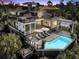 Luxury home with pool and spacious deck at dusk at 1913 Mooring Line Way, Mount Pleasant, SC 29466